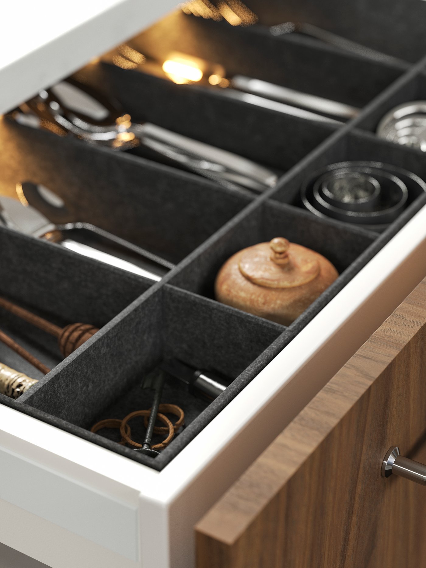 A grey UPPDATERA adjustable organiser for drawer