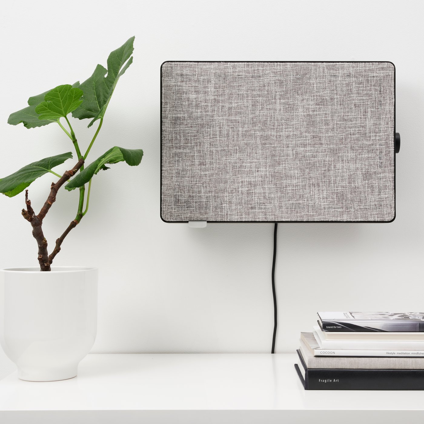 A black FÖRNUFTIG air purifier