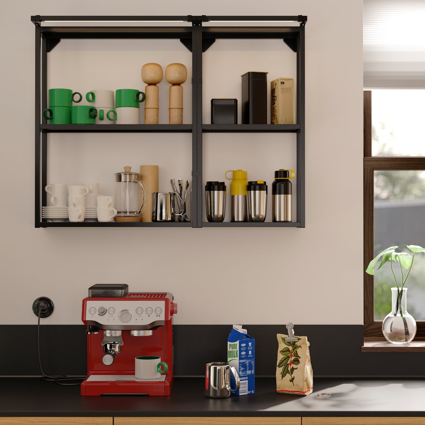 A kitchen with a MÖCKLARP black worktop and wall panel and an ENHET wall frame with shelves holding various kitchen items.