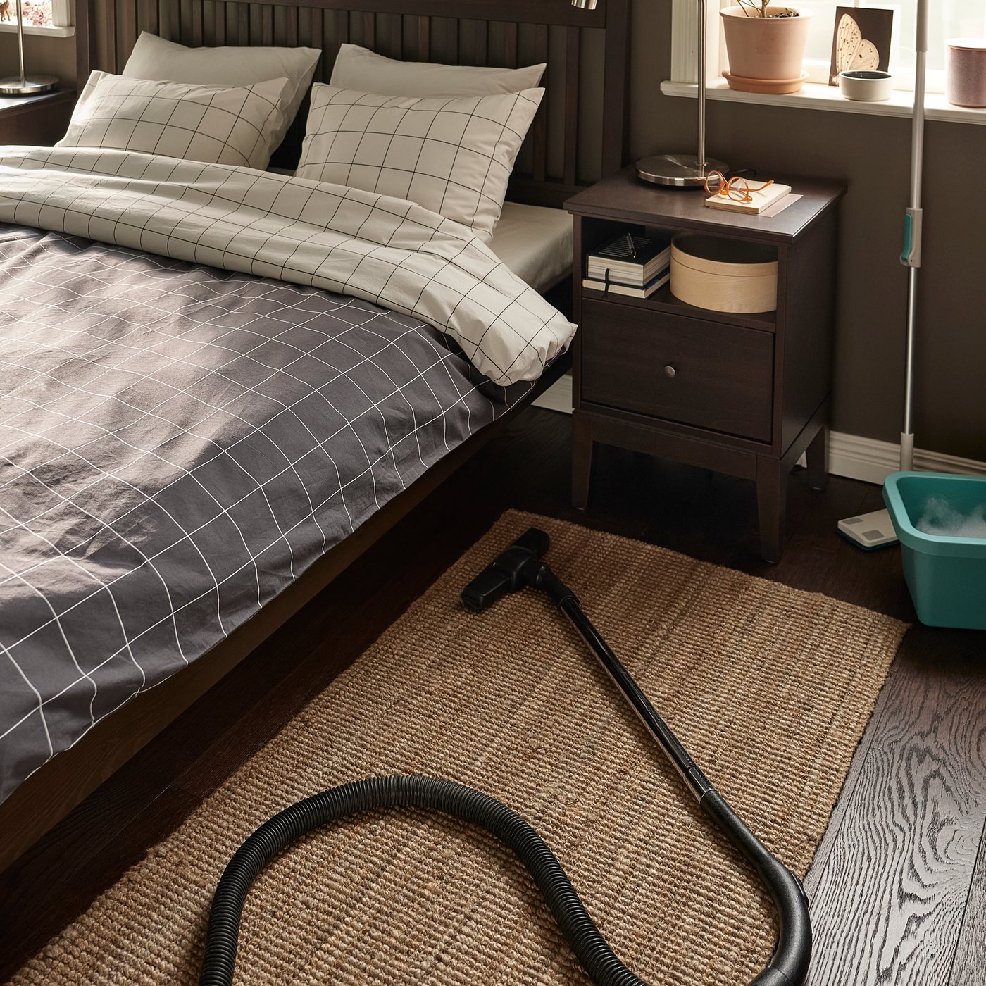 A dark brown stained IDANÄS bedside table