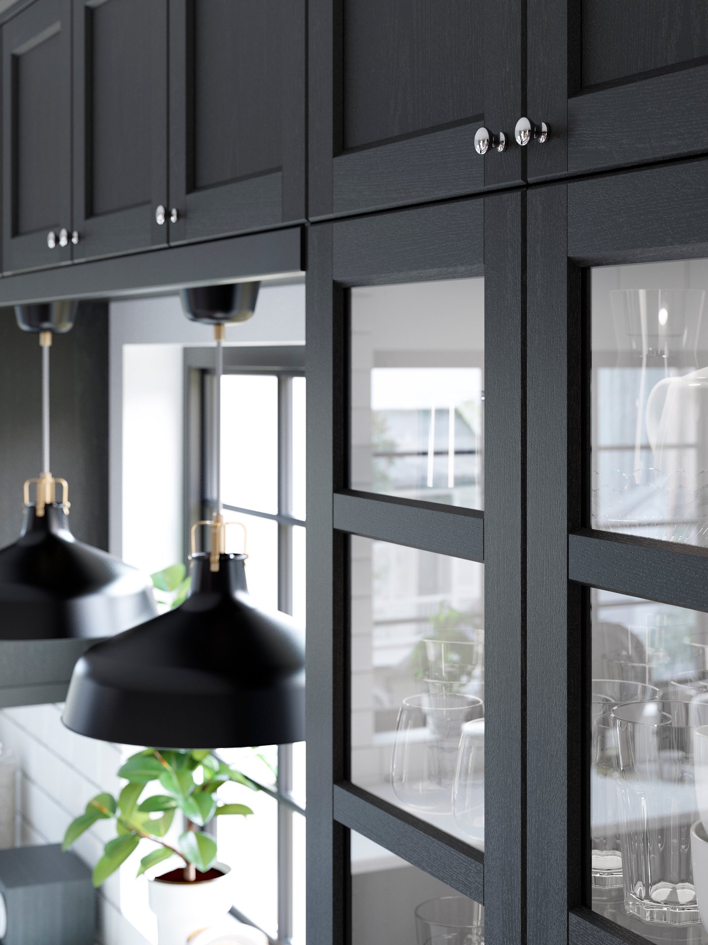 A black stained LERHYTTAN glass door in the kitchen