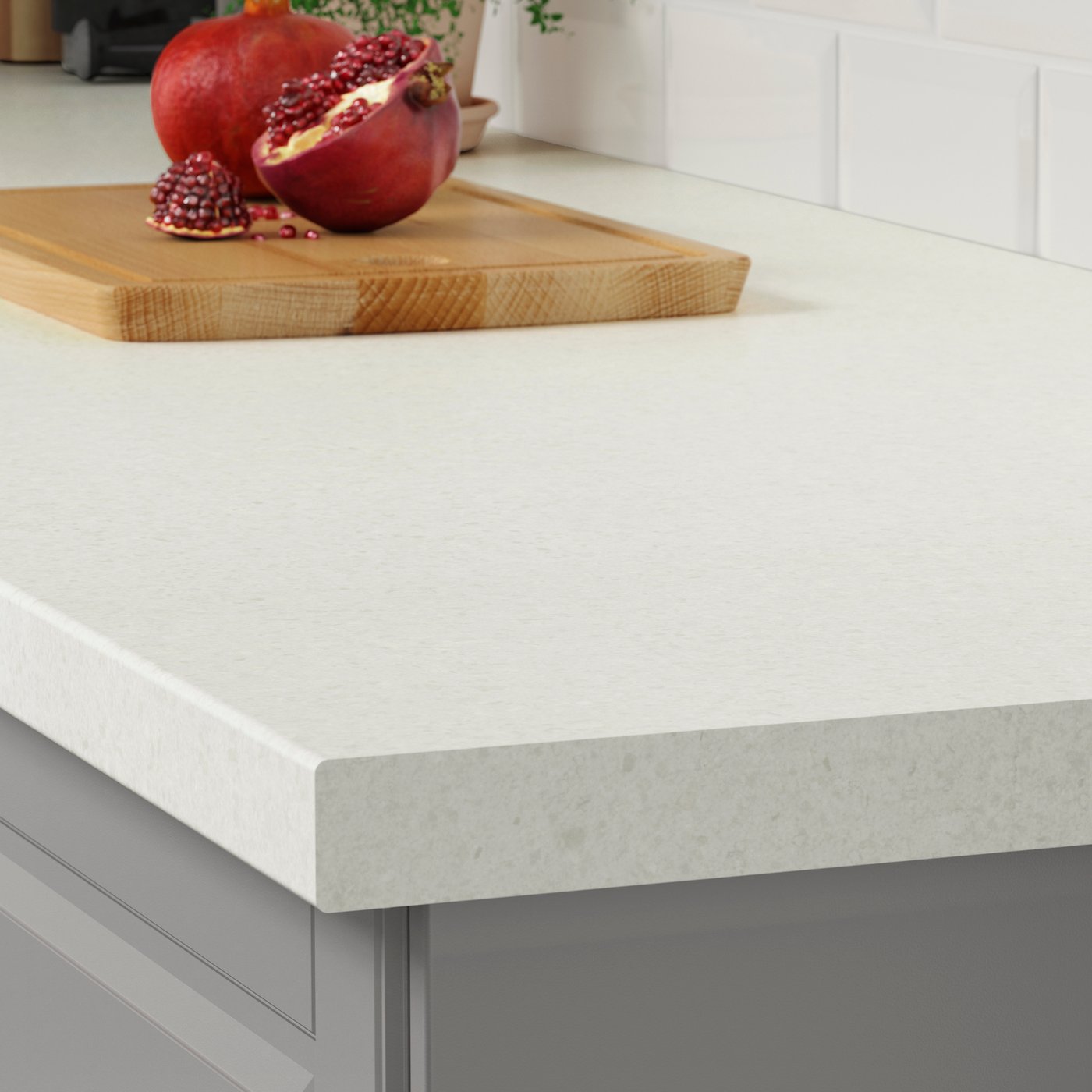 A white/light grey stone effect/laminate SÄLJAN worktop in the kitchen