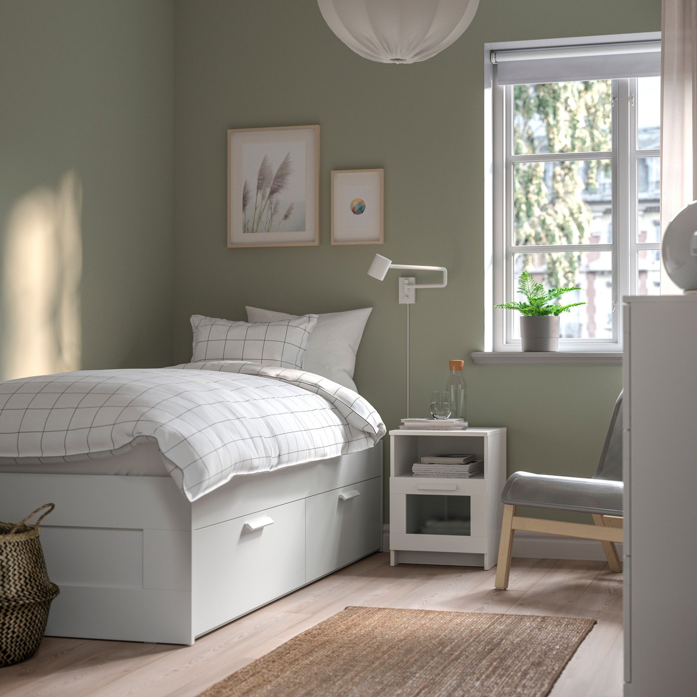 A white/Luröy BRIMNES bed frame with storage in the bedroom