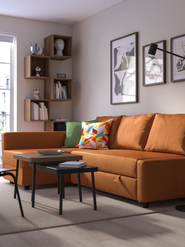 A Faringe brown-orange FRIHETEN corner sofa-bed with storage