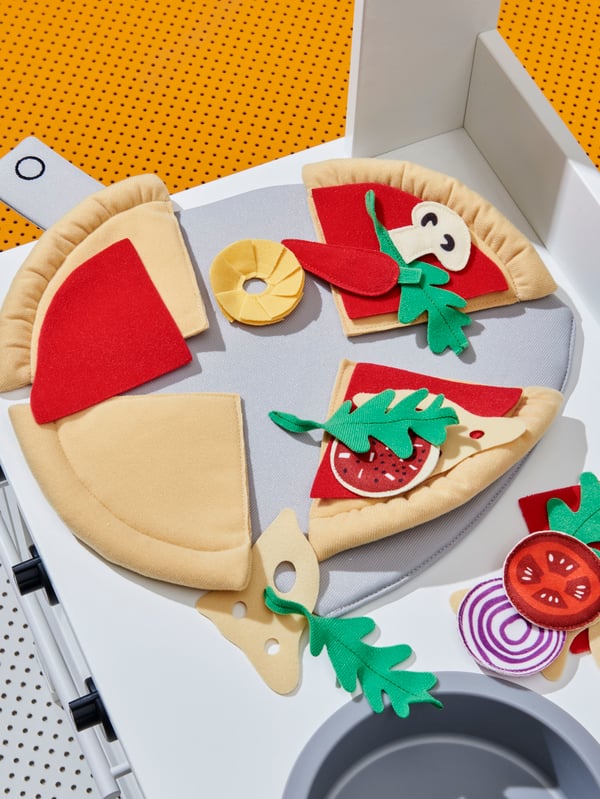 A SPISIG play kitchen with curtains
