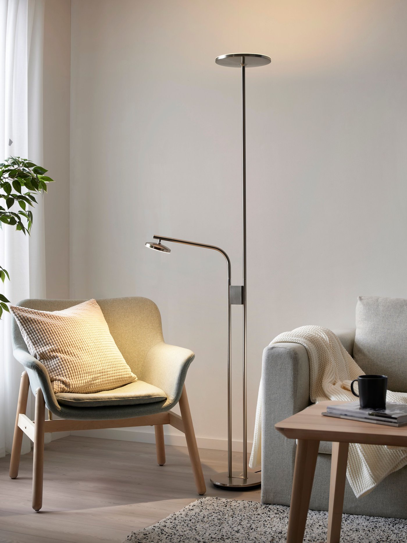 A dimmable/nickel-plated ISJAKT LED floor uplighter/reading lamp in the living room