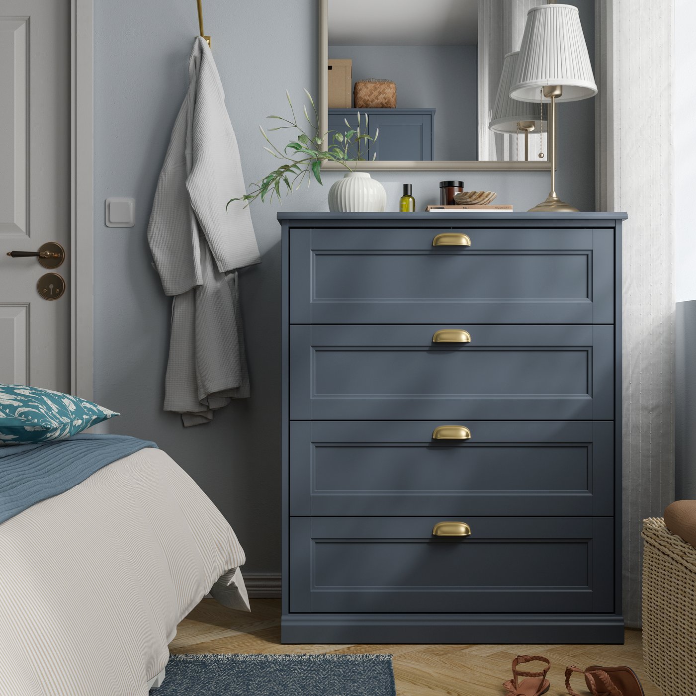 A dark grey-blue FÅGELFJÄLLET chest of 4 drawers in the bedroom