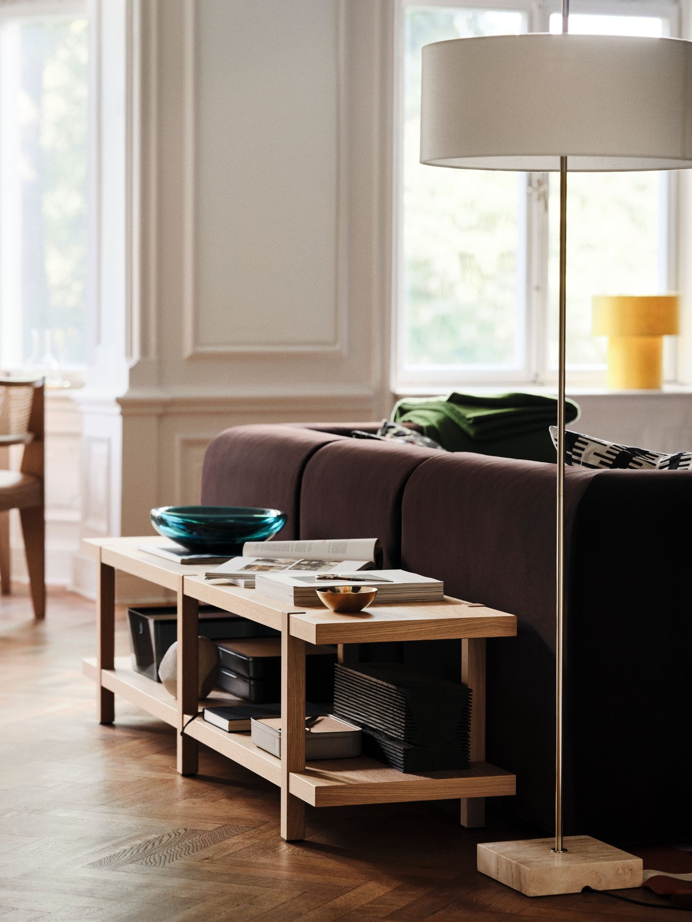 An off-white/black STOCKHOLM 2025 cushion cover in the living room