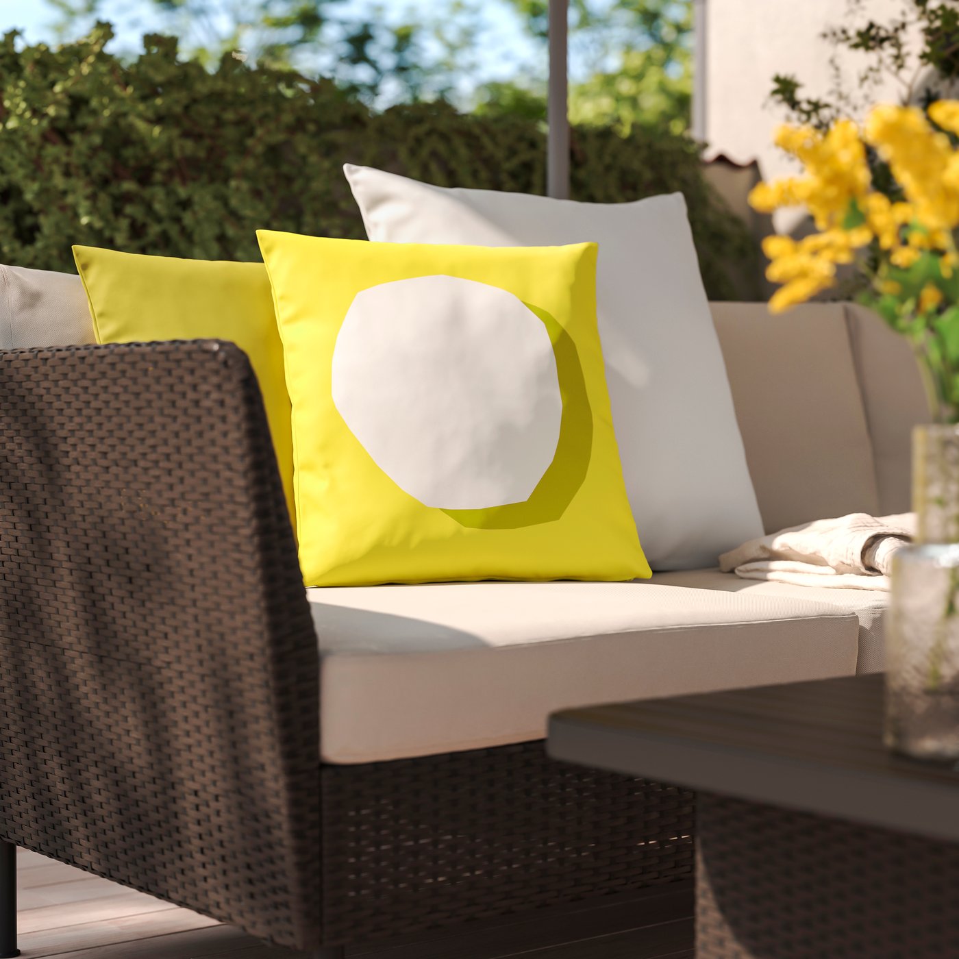 Yellow cushions on an outdoor sofa