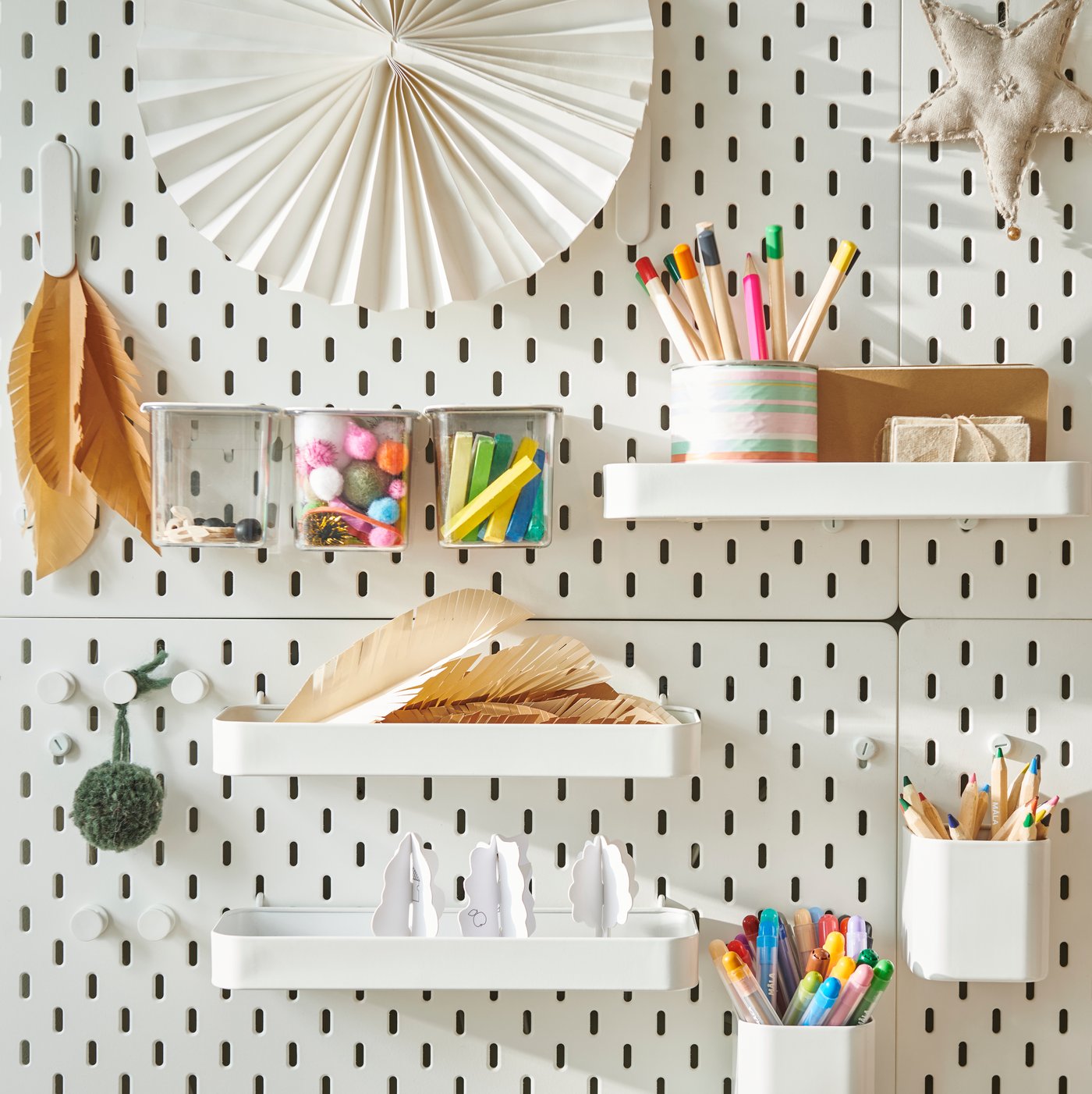 SKÅDIS pegboard with shelves and containers holding paper and colouring pencils