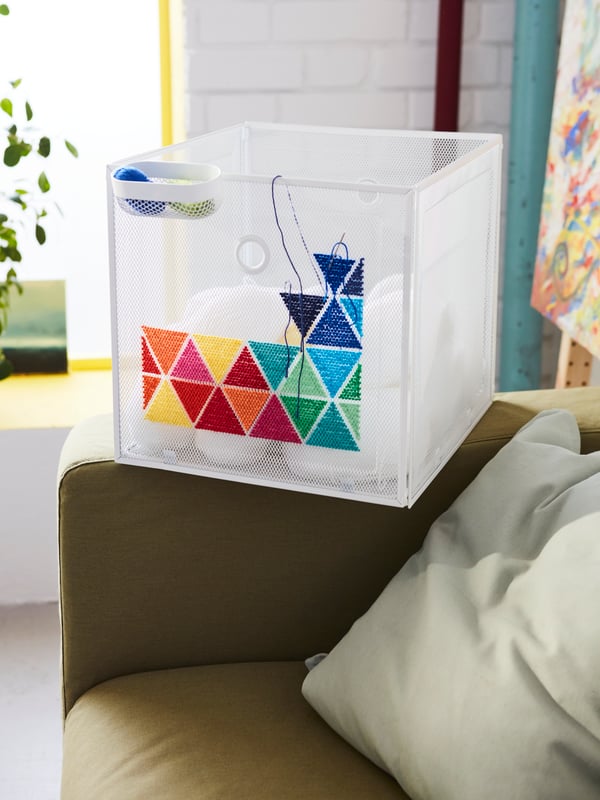 A white SKÅDIS storage basket