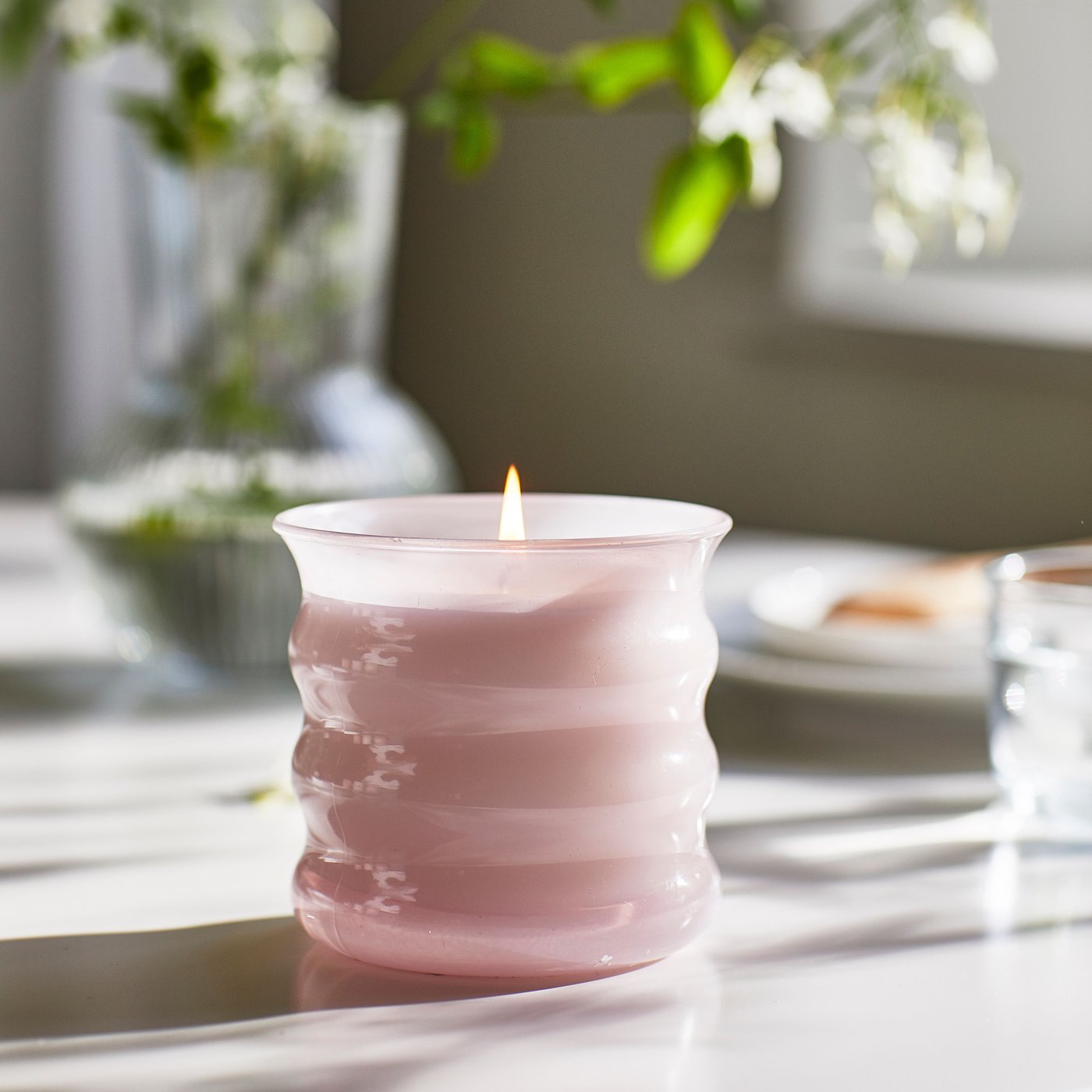 A Jasmine/pink LUGNARE scented candle in glass