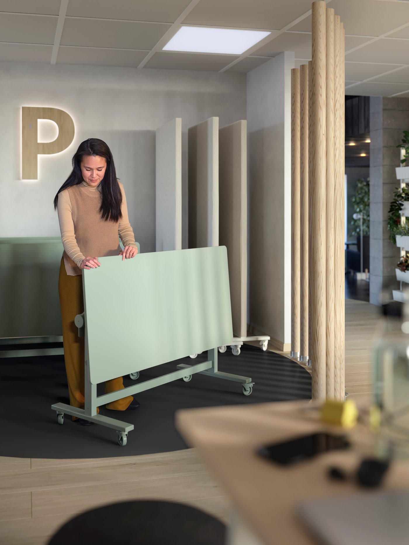Une table pliante MITTZON verte à roulettes.