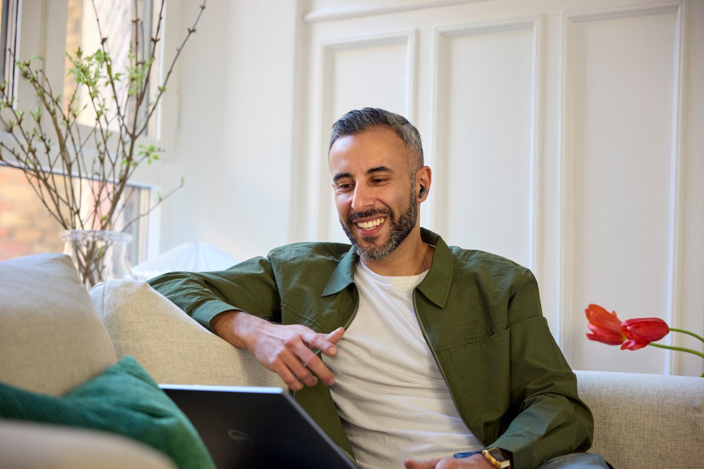 Smiling man sitting on a sofa