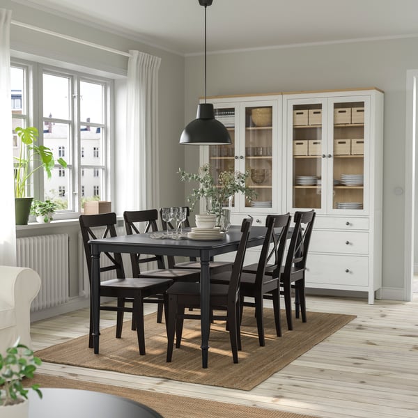 A black/brown-black DANDERYD table and 6 chairs in the dining room