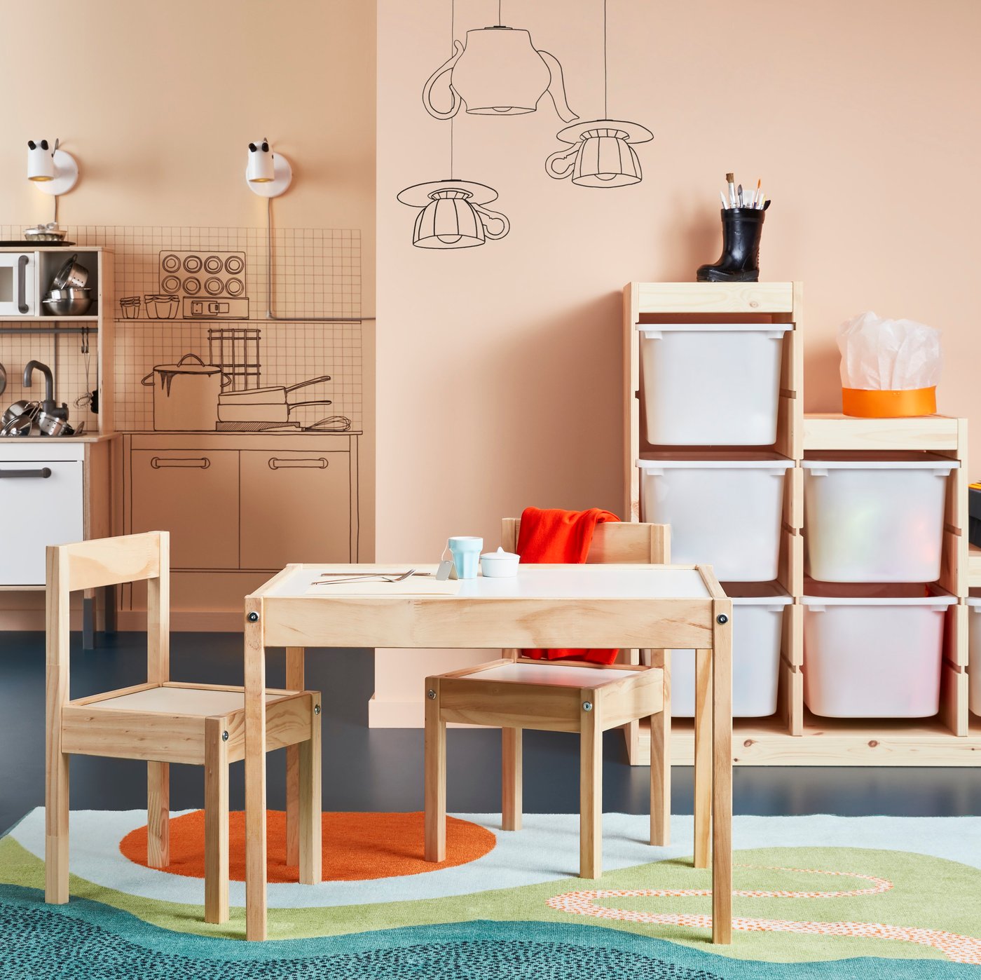 A white/pine LÄTT children's table with 2 chairs