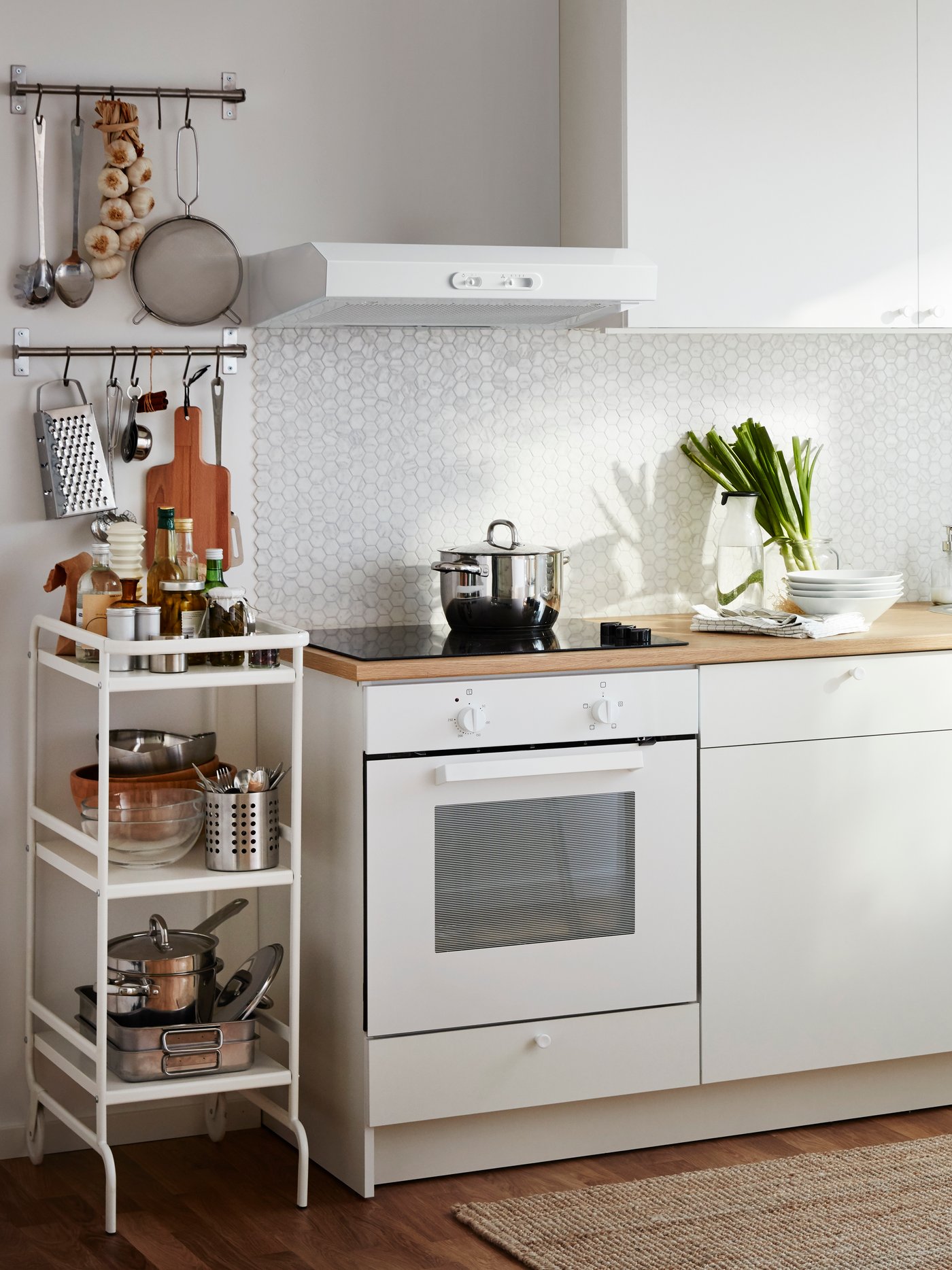 A stainless steel ORDNING cutlery stand in the kitchen