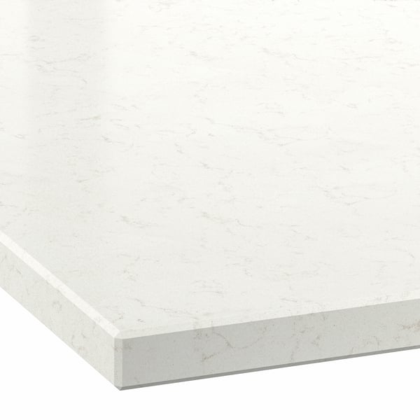 Close-up of a white marble-look countertop with subtle gray veining and a smooth, polished finish.