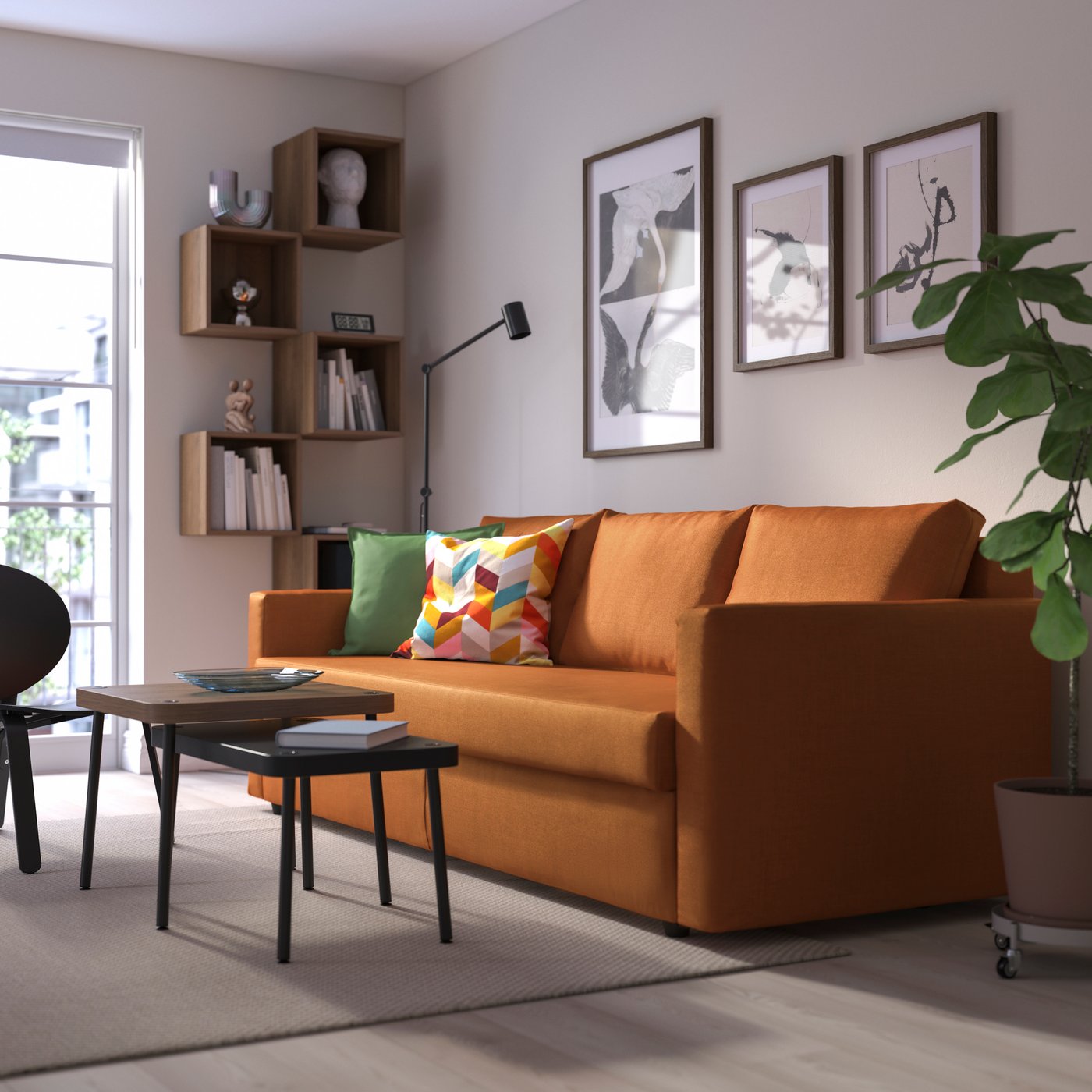 A Faringe brown-orange FRIHETEN 3-seat sofa-bed