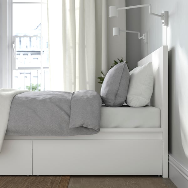 A white MALM bed frame, high, w 2 storage boxes