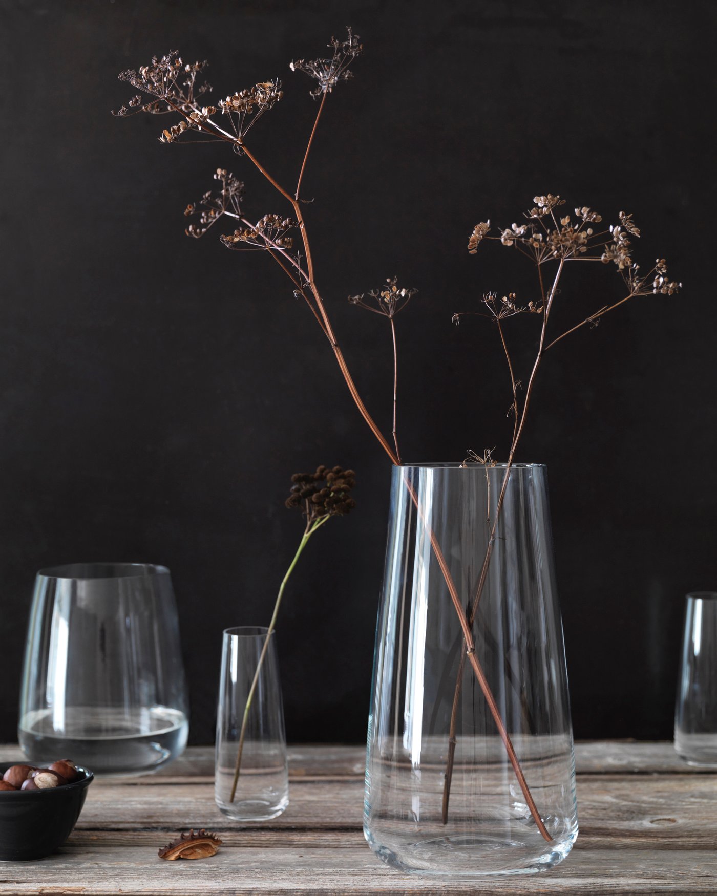 A glass vase with single flowers