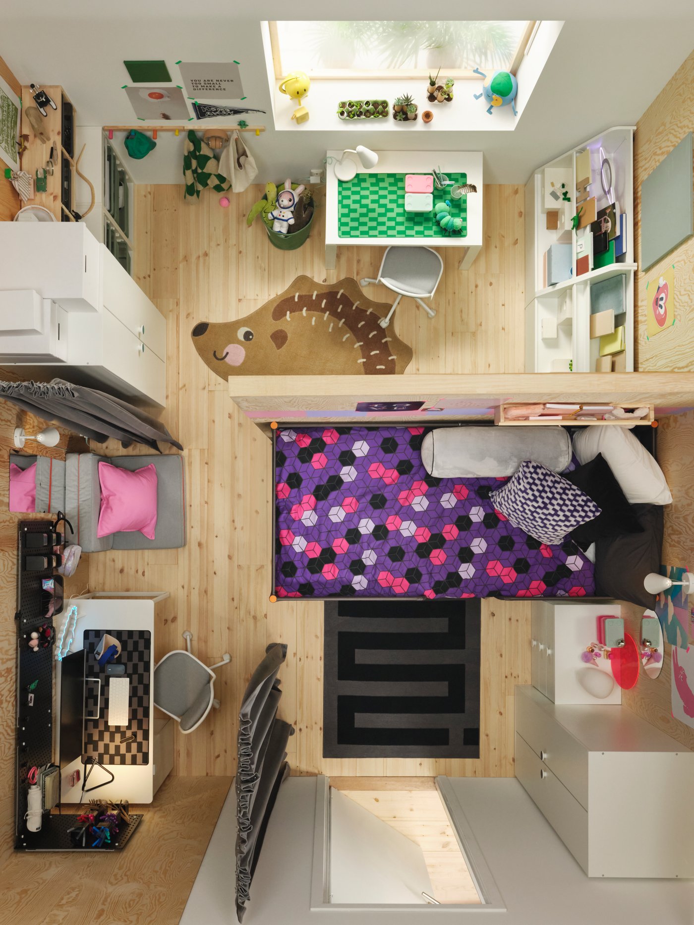 An aerial view of a kids bedroom seperated by a wall divider. One side with a BLÅSKATA rug, the other with a BRUMMIG rug.