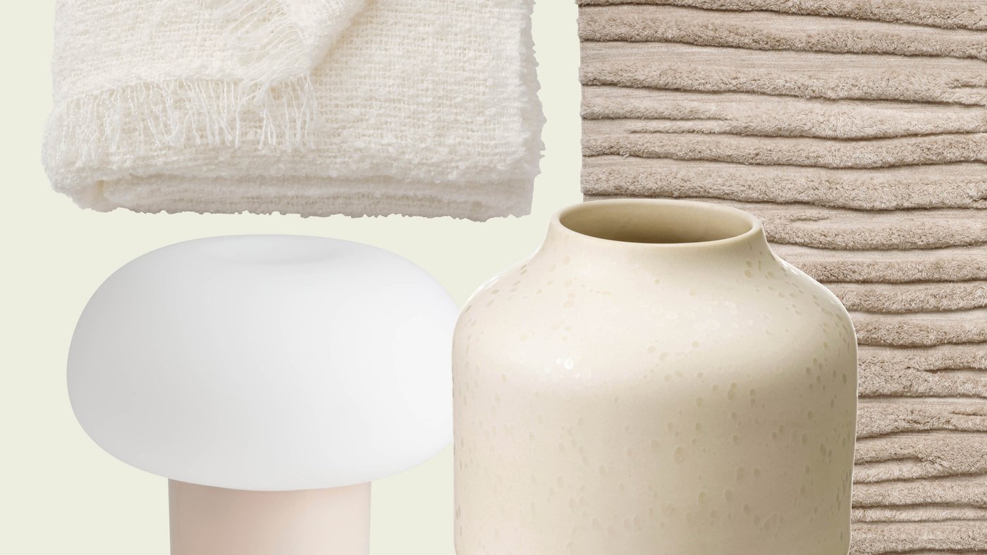 A calm combination of a soft cream throw, a textured beige vase, a rounded white lamp and a ribbed rug reflects the natural, soothing atmosphere you can create with IKEA accessories.
