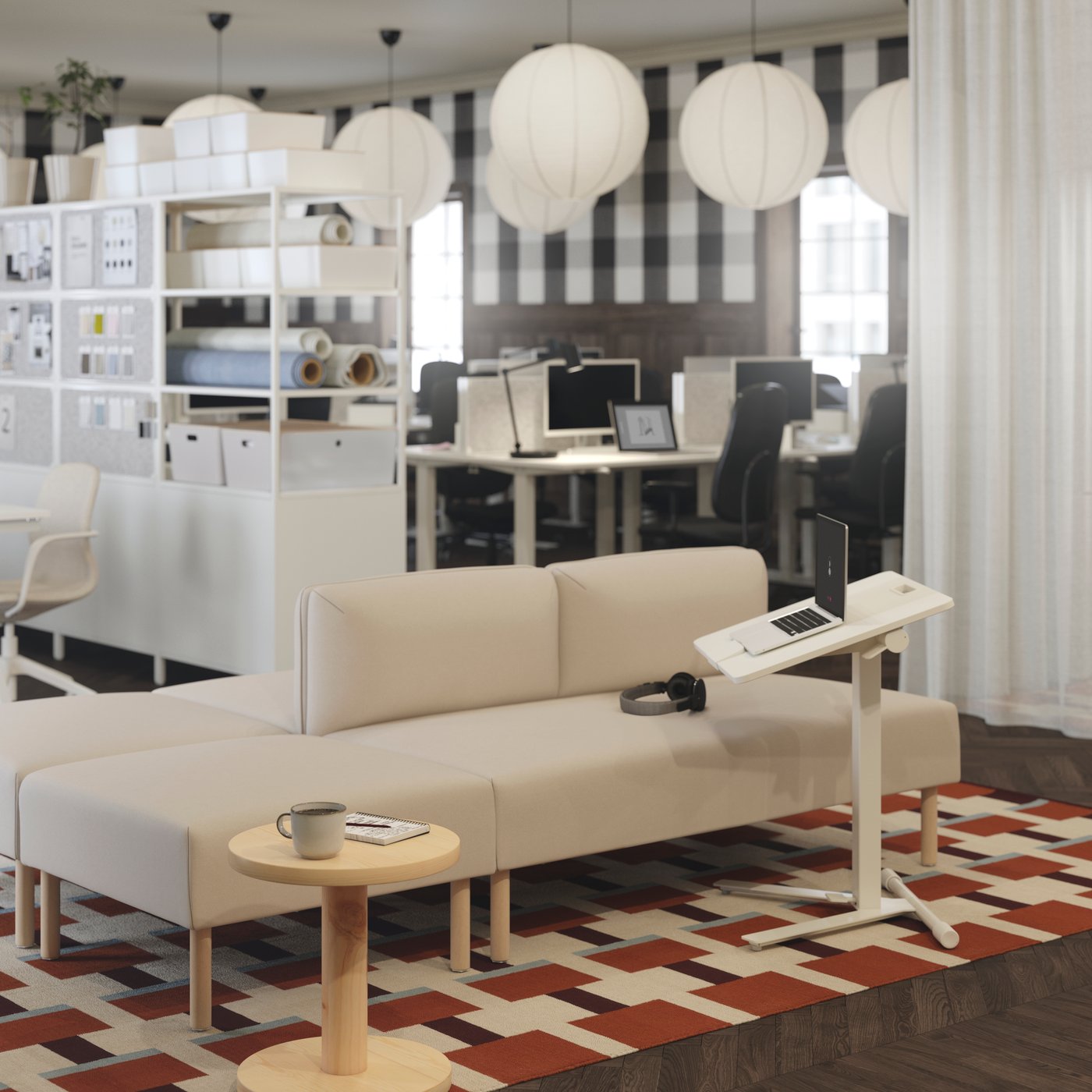 A beige LILLEHEM modular sofa with wooden legs, paired with a white MITTZON laptop table, set on a geometric patterned rug.