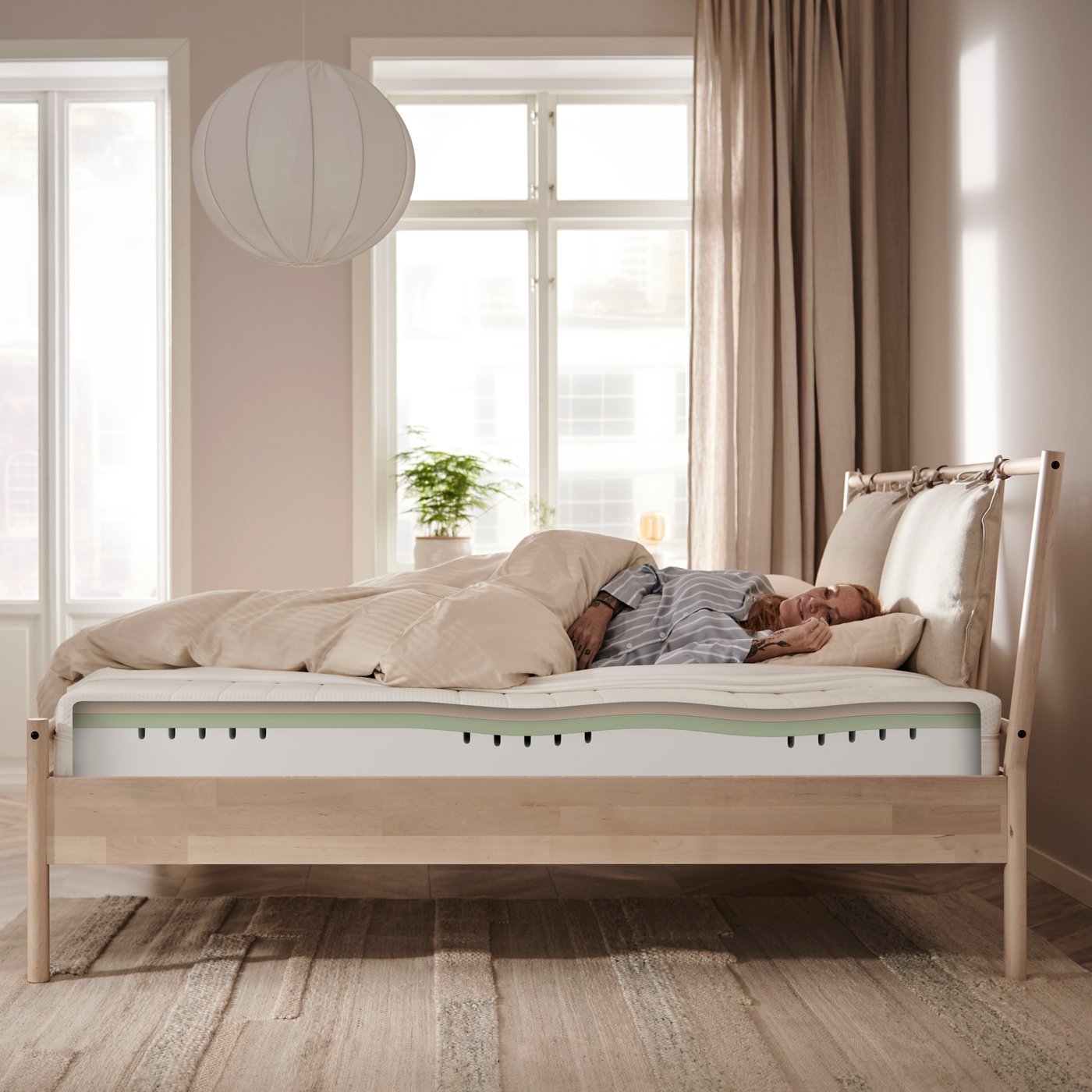 A firm/white ÅKREHAMN foam mattress in the bedroom