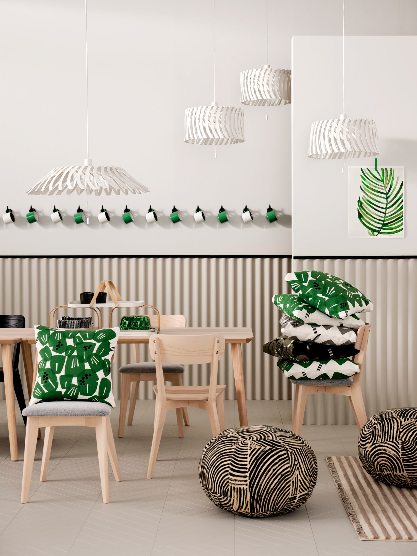 A white/green UNDERBLOMMA cushion cover