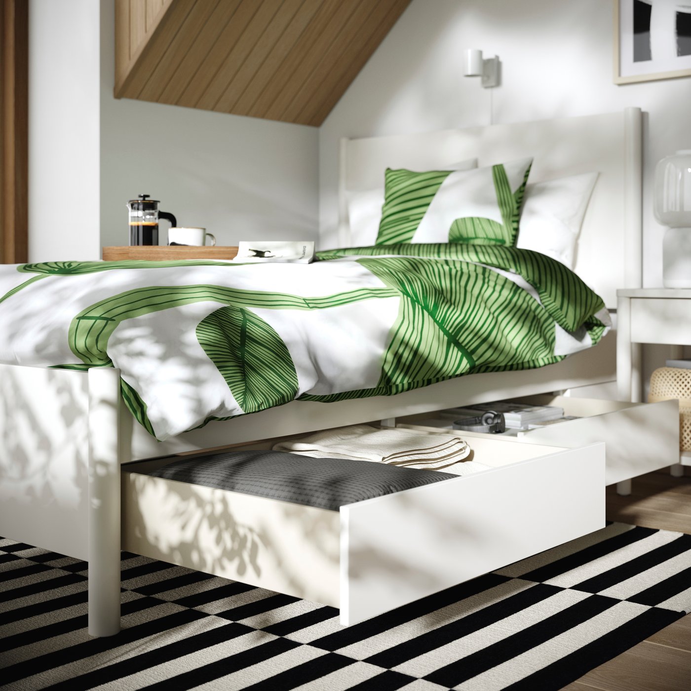 An off-white/Luröy TONSTAD bed frame with storage