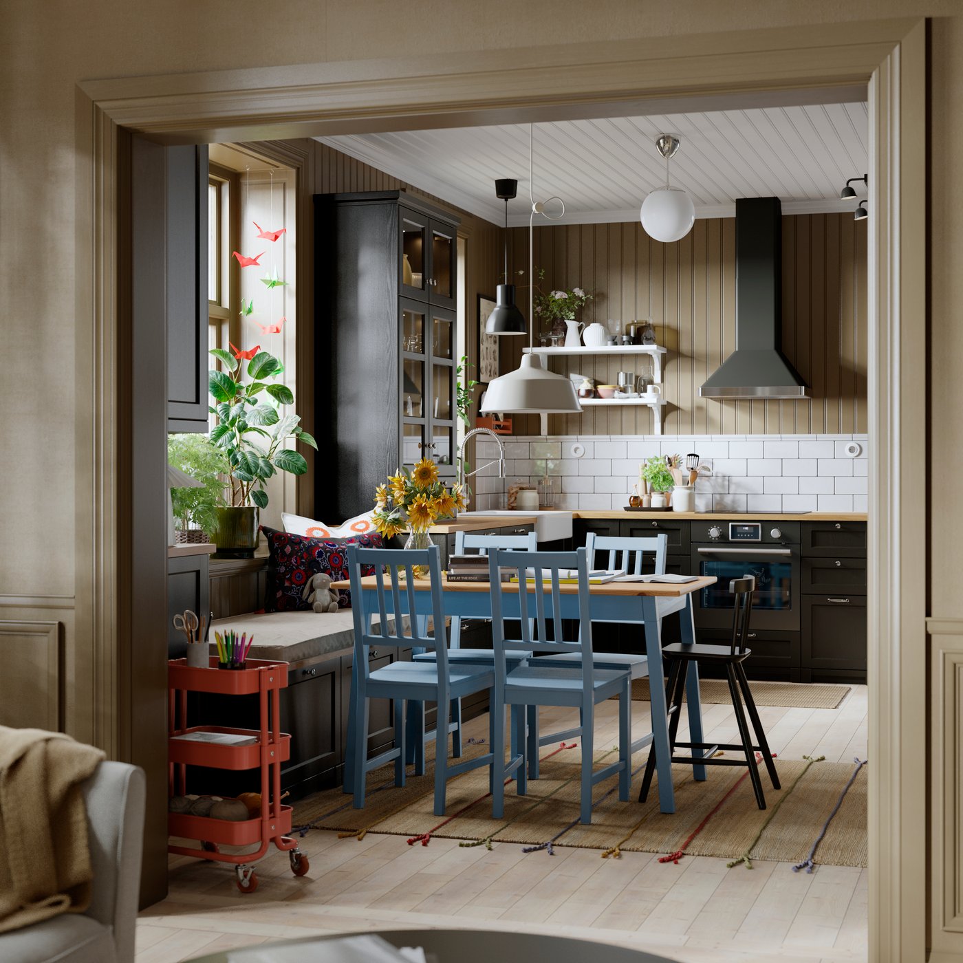 A kitchen featuring a display cabinet with black stained LERHYTTAN glass doors surrounded by cabinets and a dining area.