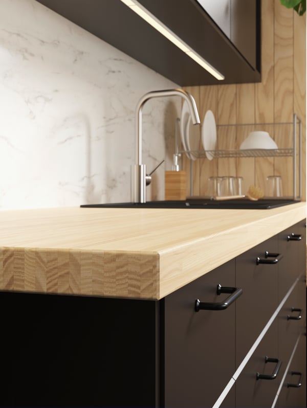 An ash/veneer PINNARP worktop in the kitchen