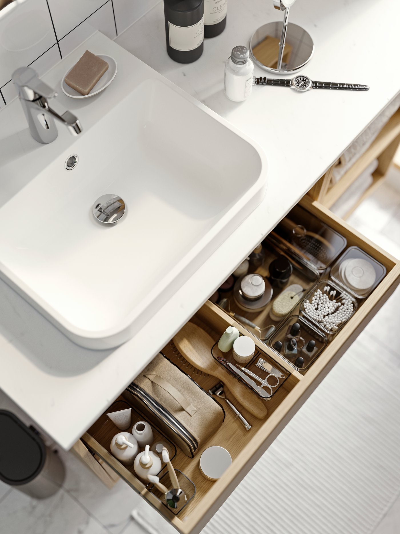 A grey VISSLAÅN drawer organisers