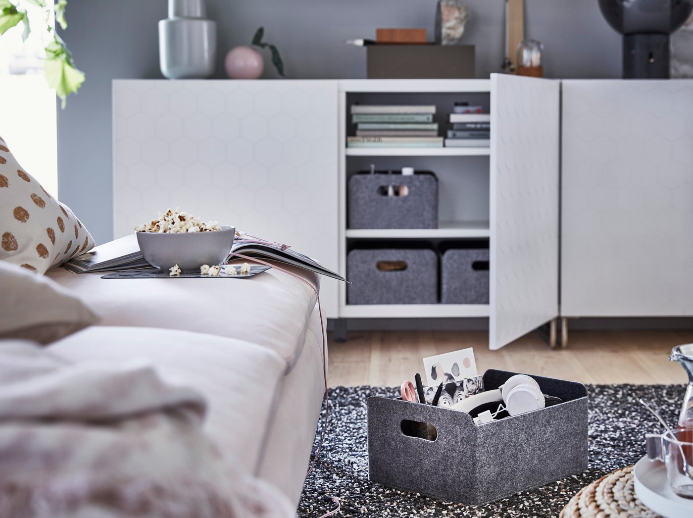 A grey BESTÅ box in the living room