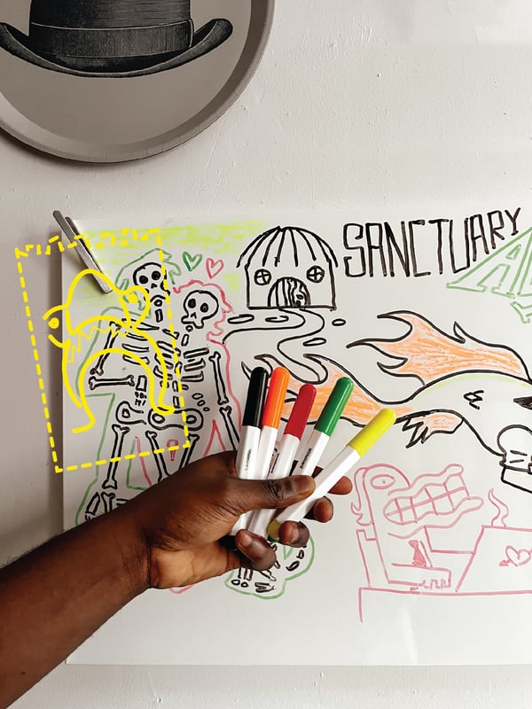 A hand holding five MÅLA whiteboard pens in front of a doodle picture.