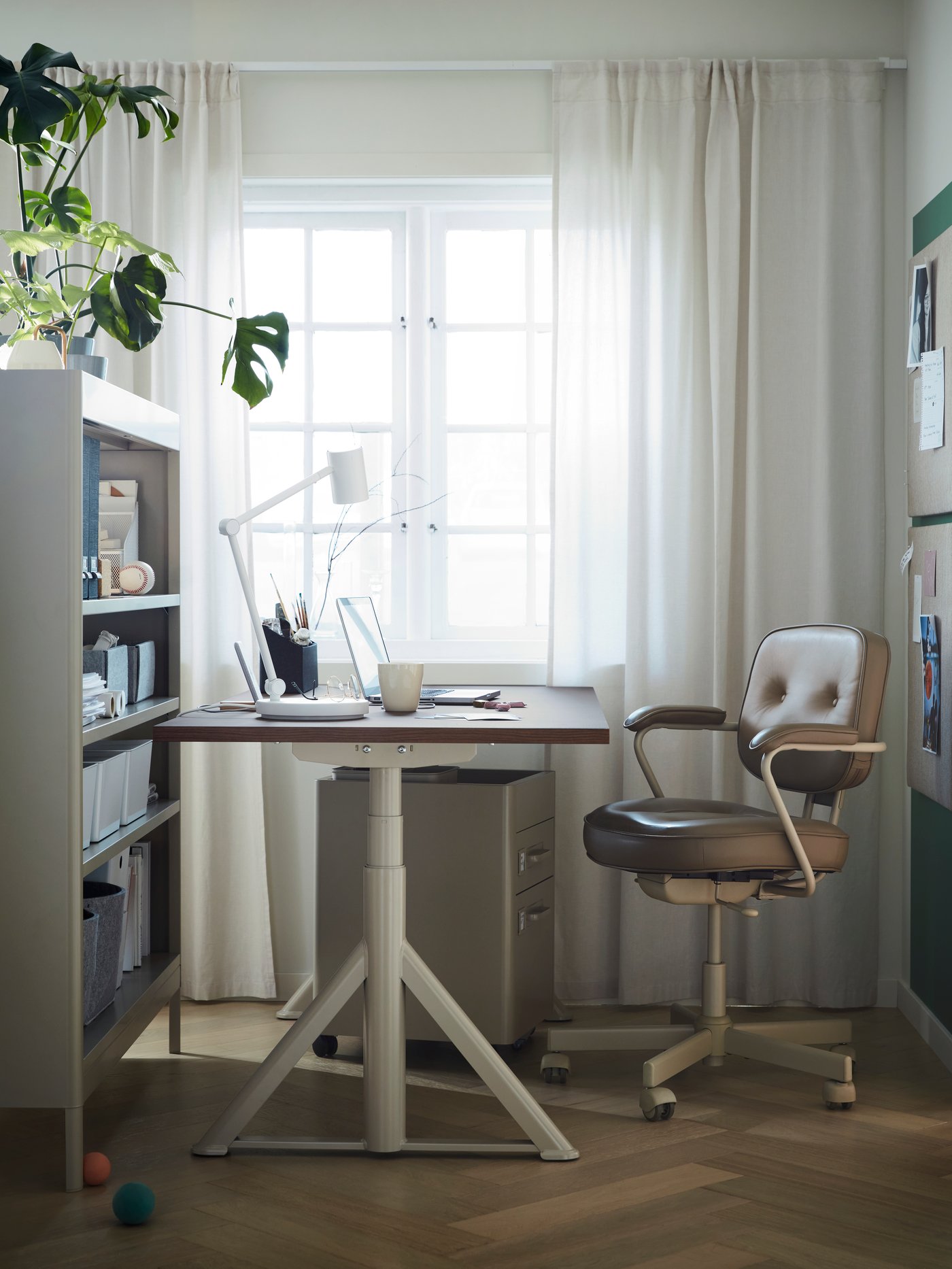 A beige IDÅSEN drawer unit on castors