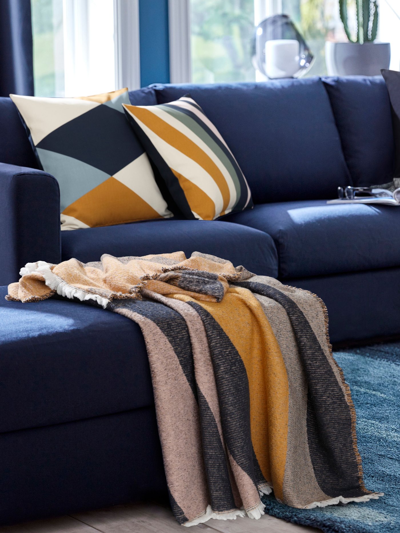 A blue U-shaped sofa.