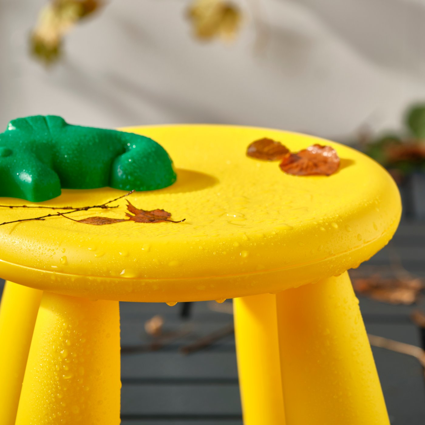 An in/outdoor/yellow MAMMUT children's stool