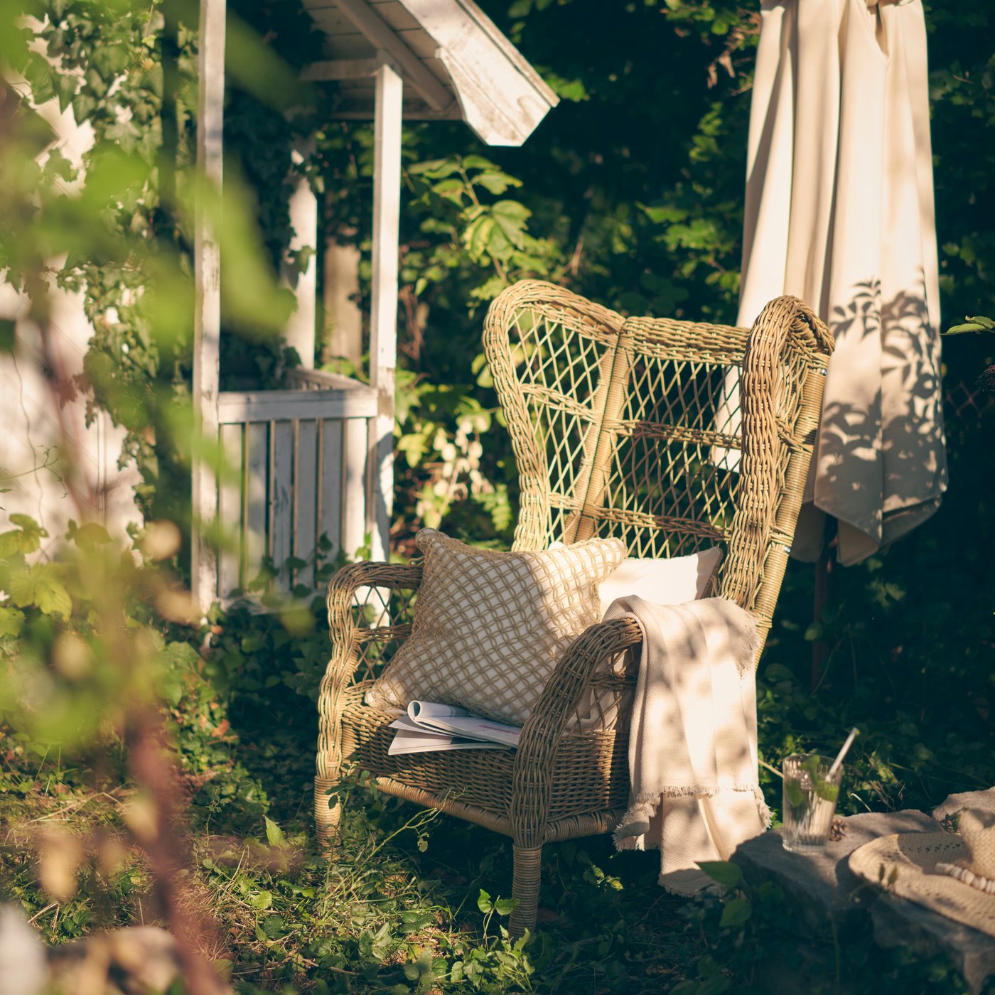 A brown RISHOLMEN wing chair, in/outdoor