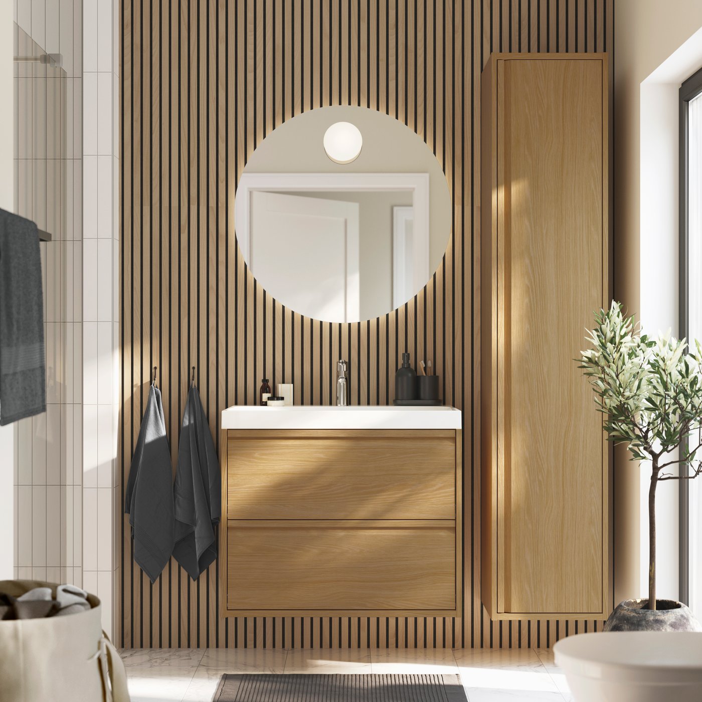 An oak effect ÄNGSJÖN wash-stand with drawers in the bathroom