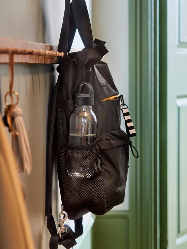 bag hanging on hook in hallway