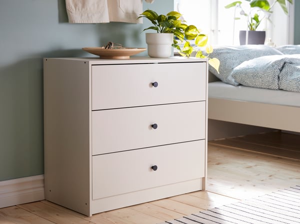 A light beige GURSKEN chest of 3 drawers