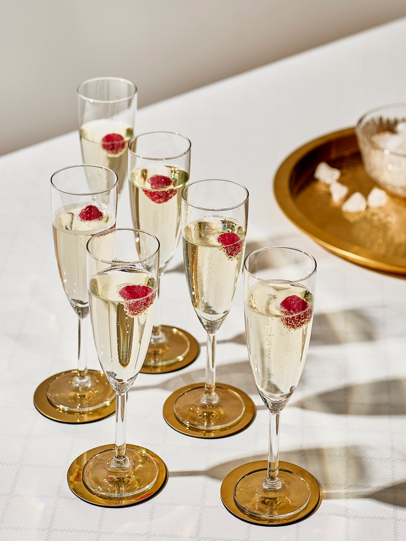 A clear glass SVALKA champagne glass