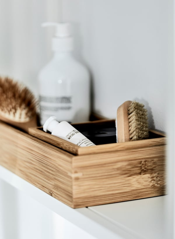 Bathroom essentials stored in a TAVELÅN tray with edges.