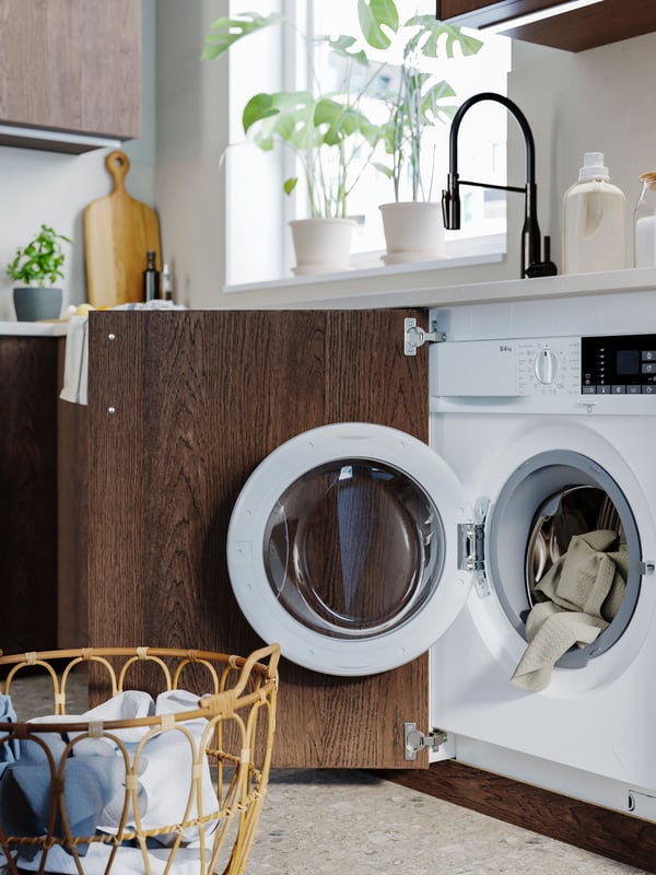 A white TVÄTTAD integrated washing machine/dryer