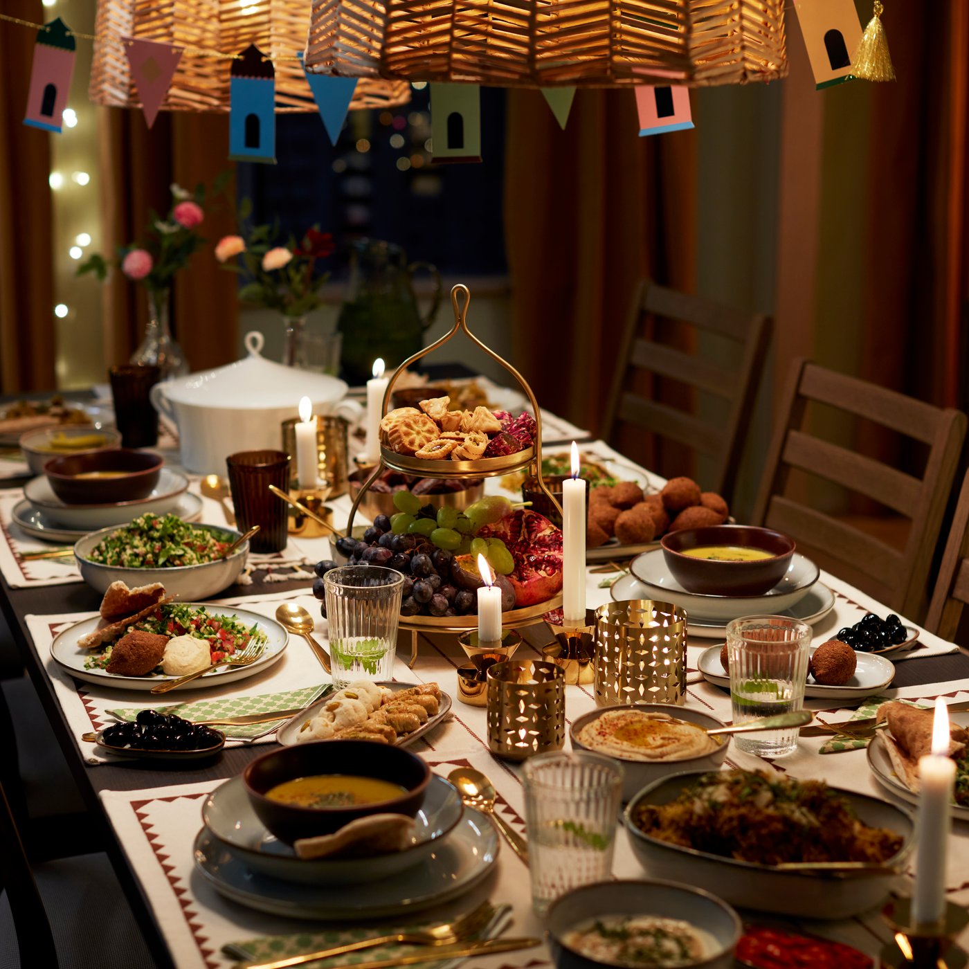 A festive table set for Ramadan with the colourful GOKVÄLLÅ Ramadan collection.