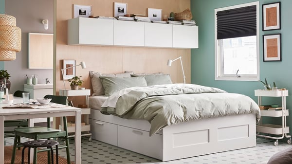 A white BRIMNES bed on the center of the bedroom.