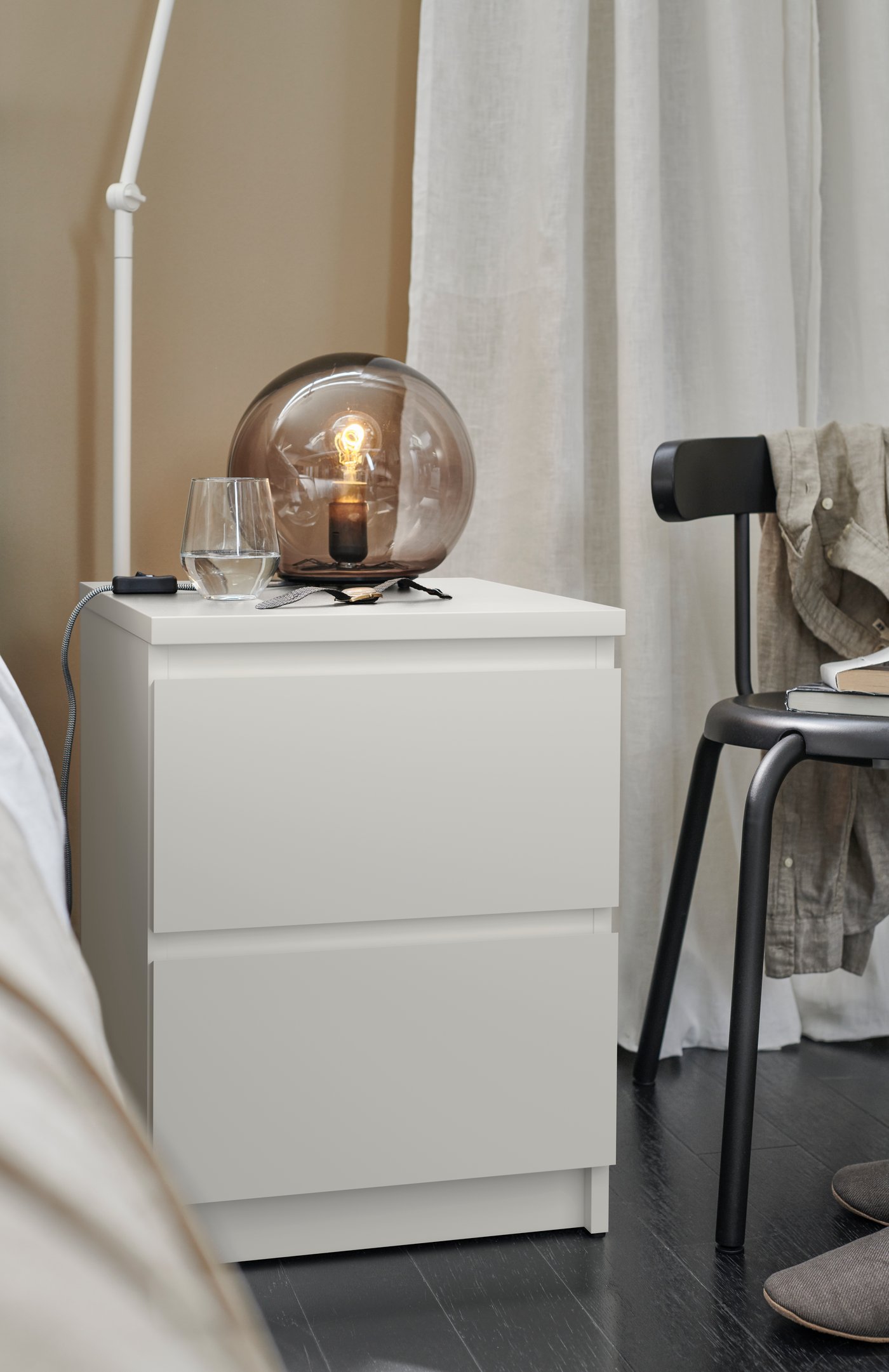 A white MALM chest of 2 drawers in the bedroom