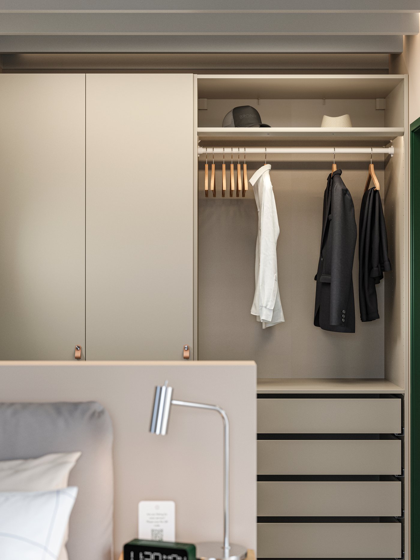 A hotel room with a PAX/FORSAND wardrobe with open and closed storage, a few clothes, hats, hangers and drawers.